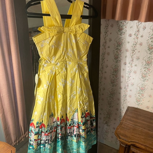 Lindy Bop Dresses & Skirts - BNWT! Lindy Bop dress. Front bow. Pleats. Pockets. Bottom is lined.